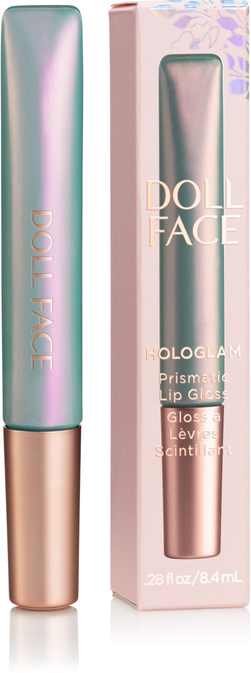 Ein Tube Doll Face Hologramm Lipgloss neben der Verpackung. Das Tube ist glänzend mit Pastellfarben.