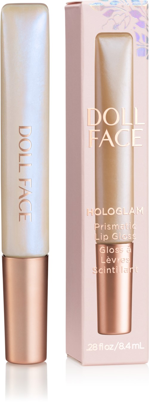 Eine Tube mit heller Farbe und roségoldener Kappe neben ihrer rosa Verpackung mit Produktinformationen.