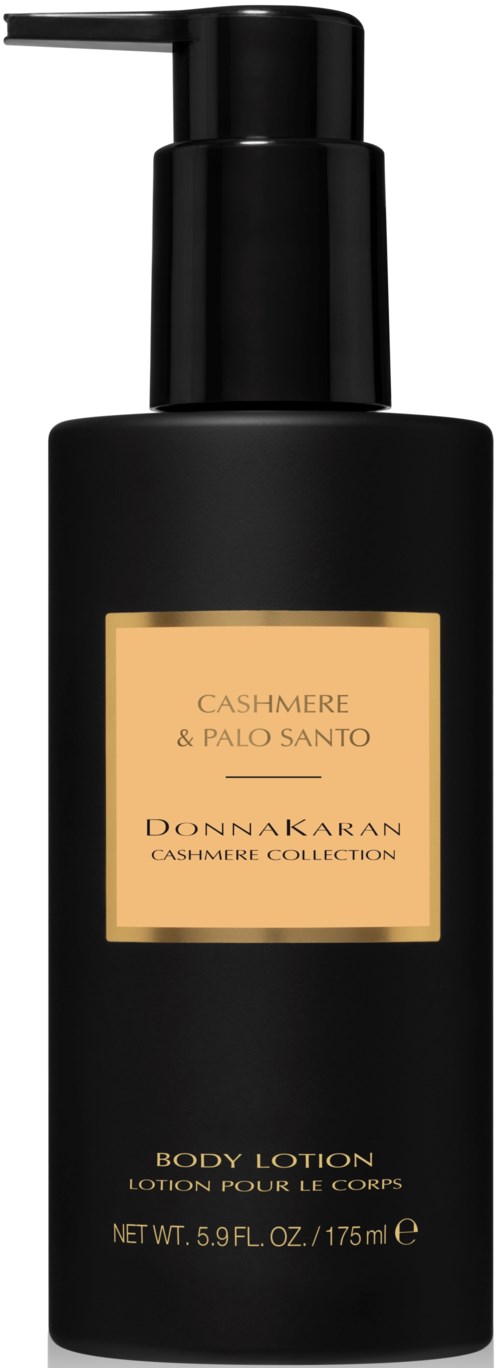 A black body lotion bottle with a pump, labeled Cashmere & Palo Santo from Donna Karan's Cashmere Collection.