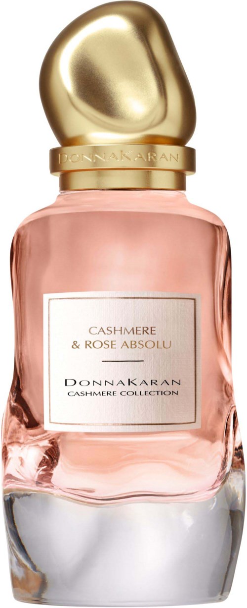 Rosa parfymflaska med en guldtop, märkt Cashmere och Rose Absolu, från Donnakarans Cashmere Collection.