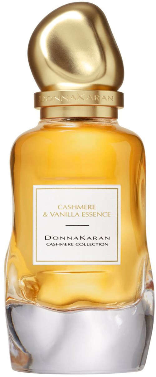 Een parfumbeker met een gouden dop en een label dat zegt Cashmere & Vanilla Essence door Donnakaran.