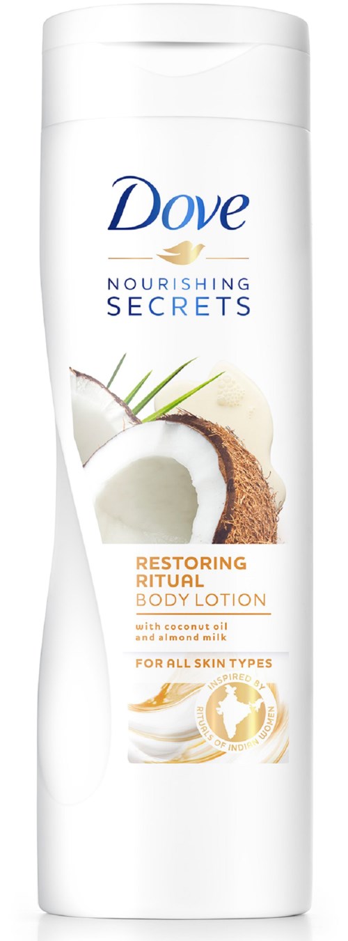 Eine weiße Flasche Dove nourishing secrets restoring ritual body lotion mit Kokos, geeignet für alle Hauttypen.