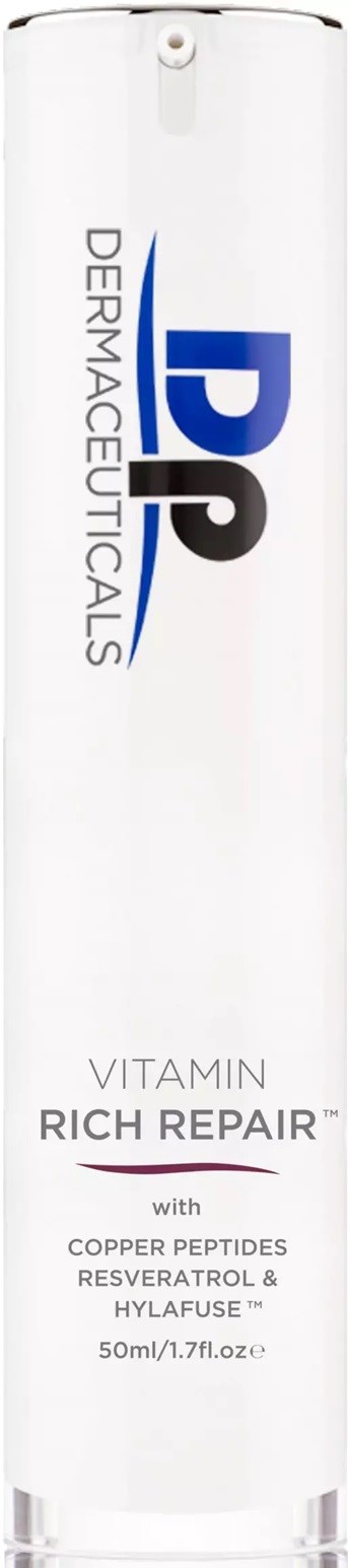 A tall white bottle with blue and black logo and text, featuring ingredients like copper peptides and hyaluronic acid.