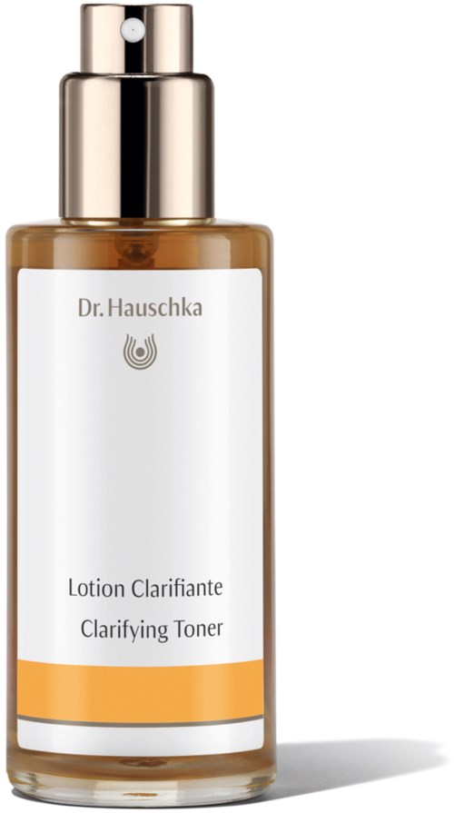 Brązowa butelka z srebrnym zamknięciem, oznaczona jako Clarifying Toner marki Dr. Hauschka.