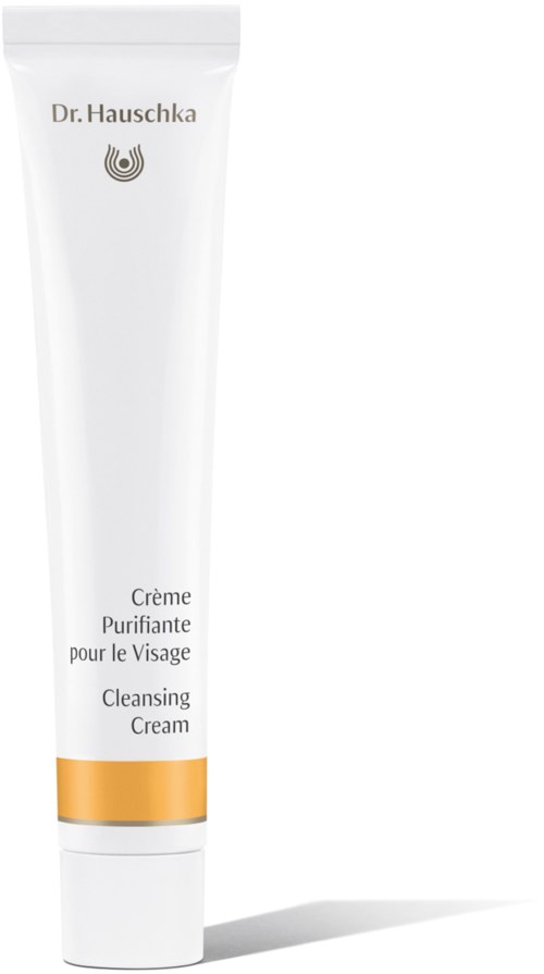 A white tube with a gold band, labeled 'Dr. Hauschka Cleansing Cream' for face care.