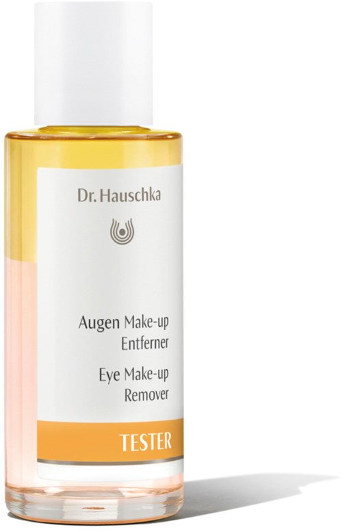 A small bottle with a label saying 'Dr. Hauschka Eye Make-up Remover Tester'. It is clear with a white cap.