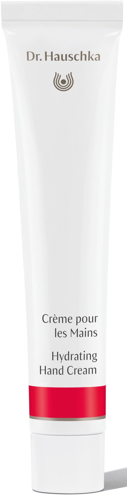 Eine weiße Tube mit der Aufschrift 'Dr. Hauschka Hydrating Hand Cream' und einem roten Band am unteren Ende.