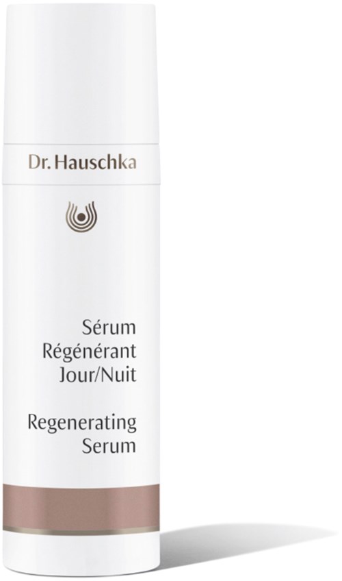 A white bottle with the label 'Dr. Hauschka,' contains regenerating serum for day and night use.