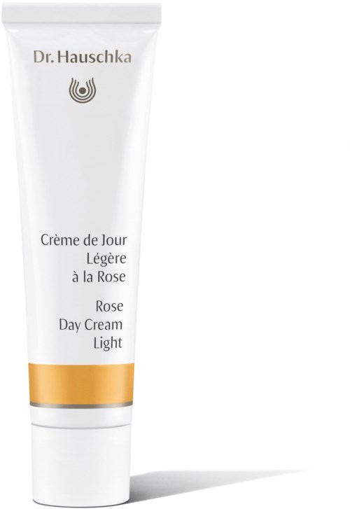 Eine weiße Tube mit Dr. Hauschka Rose Day Cream Light mit goldenen und grauen Akzenten.
