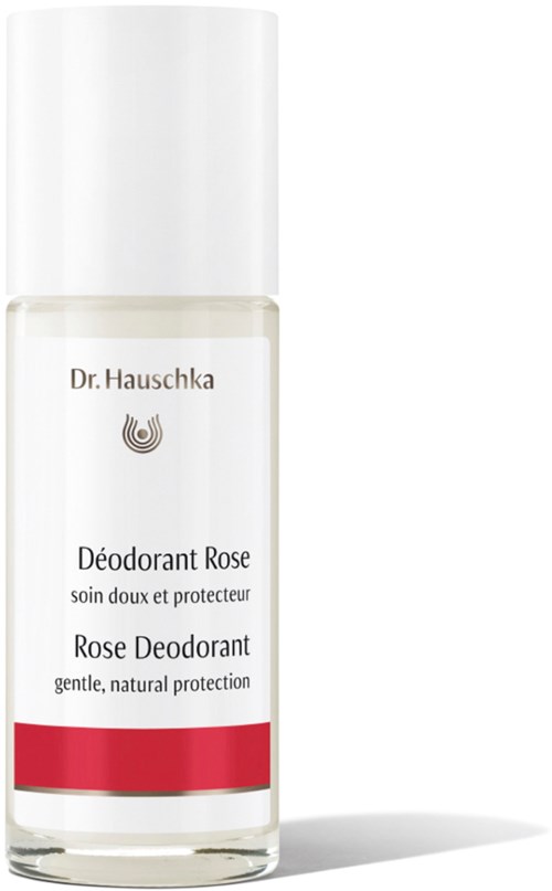 Een flesje Dr. Hauschka Rose Deodorant, wit met rode strip, voor zachte bescherming.