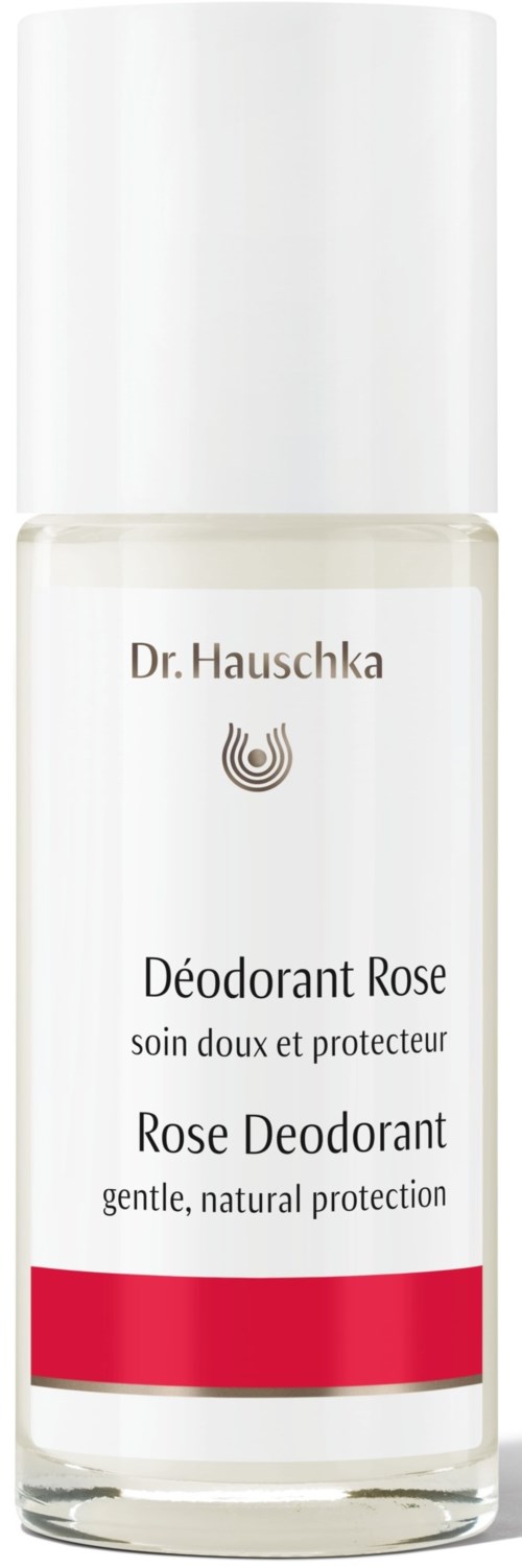 A clear bottle of rose deodorant with white cap and red band, labeled in French and English.