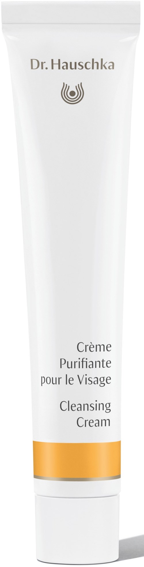 A white tube labeled Dr. Hauschka with orange band, says Cleansing Cream for face, clean and simple design.