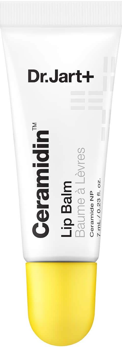En vit tub med gul kork, märkt Dr. Jart+ Ceramidin Lip Balm, avsedd för läppar, med svart text.