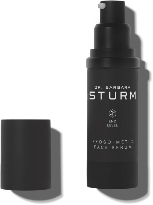 A black bottle labeled Dr. Barbara Sturm Exo-Metic Face Serum with a cap beside it.