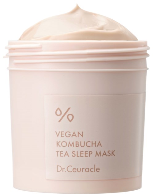 Een witte pot met deksel, gevuld met romige thee-slaapmasker, gemerkt 'Vegan Kombucha Tea Sleep Mask' door Dr. Ceuracle.