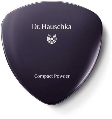 A black container with a logo and text, labeled 'Dr. Hauschka' and 'Compact Powder'.