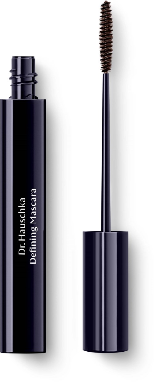Ein schwarzer Mascara-Tube mit Bürste, beschriftet "Dr. Hauschka Defining Mascara."