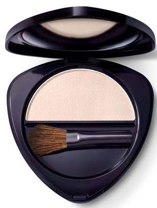 Compact with light-colored powder and a small brush inside.