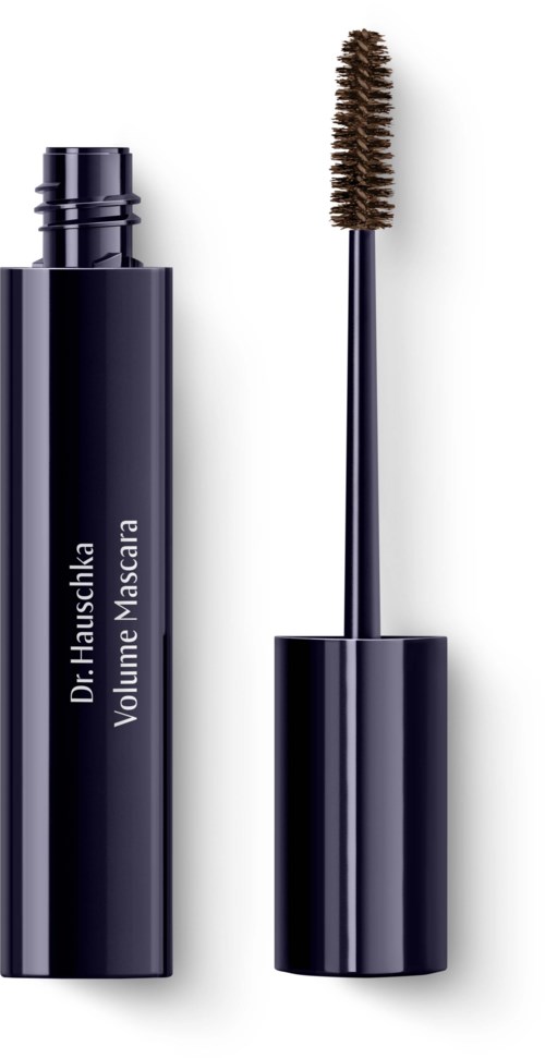A black mascara tube with a wand placed beside it, labeled "Dr. Hauschka Volume Mascara."
