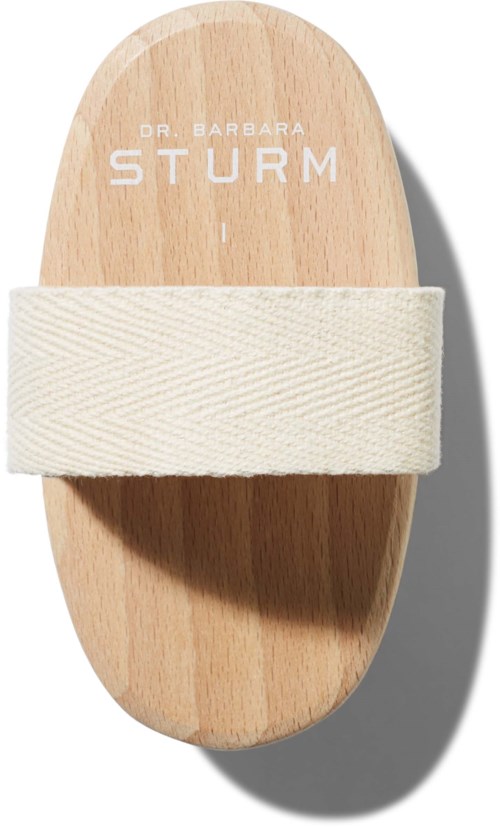 Ein Holzgerät mit einem Stoffband, beschriftet 'Dr. Barbara Sturm', wahrscheinlich für Hautpflege oder Schönheitsbehandlung.