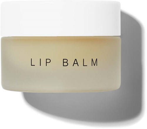 Ein kleiner Behälter mit weißem Deckel, beschriftet "Lip Balm" vor weißem Hintergrund.