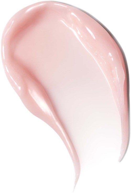 Smooth, light pink skincare cream spread on a white surface with a glossy finish.