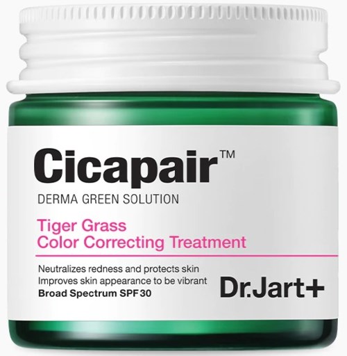 En grön burk märkt 'Cicapair' för hudvårdsbehandling, med rosa text om tigergräs och färgkorrigering.
