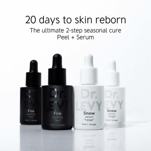 Fyra hudvårdsflaskor, två svarta märkta Fire och två vita märkta Snow, med droppkapslar för serum och peelinggel.