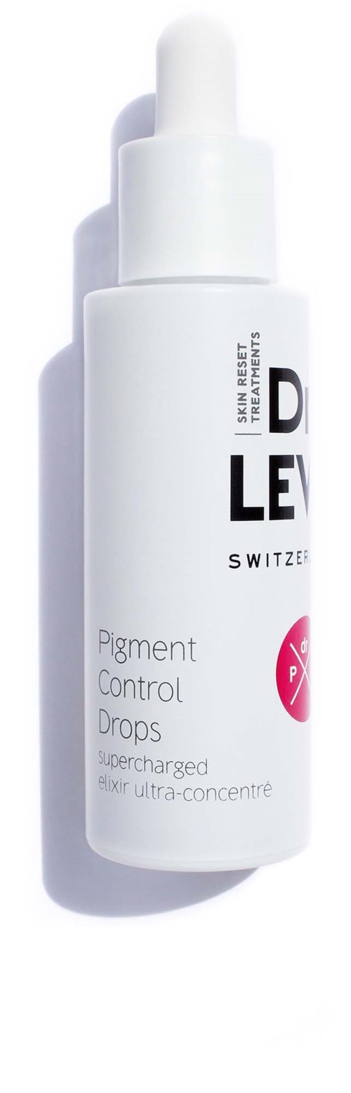 Vit flaska med pipettlock, märkt som Pigment Control Drops, superladdad för mycket koncentrerad hudvård.