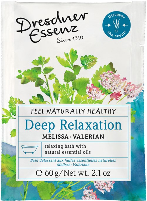 Ett förpackning med gröna växter, rosa blommor och blå accenter, med text som främjar avkopplande badprodukter med naturliga oljor.