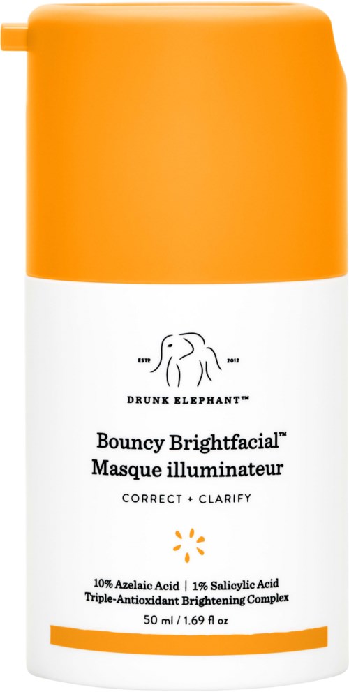 Et hudpleieprodukt i en hvit flaske med oransje lokk, merket Drunk Elephant Bouncy Brightfacial.