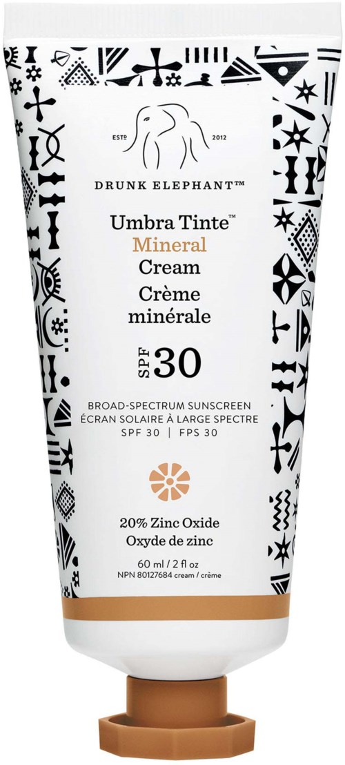 Tub med mineral solkrem med SPF 30, svart-hvitt design, og brun hette. Inneholder sinkoksid.