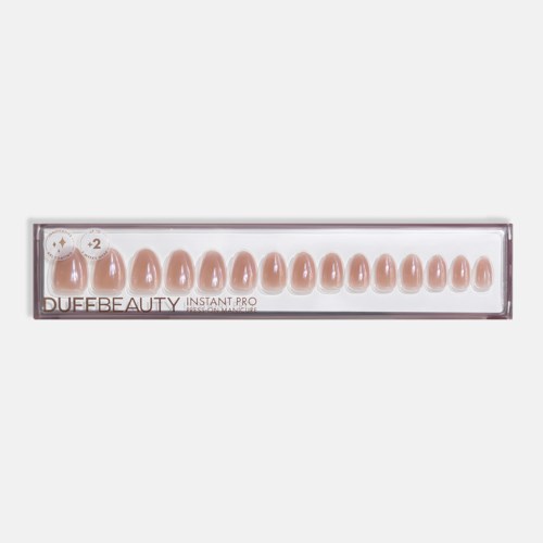 Box of realistic nail tips in light skin tone, arranged in a row with different sizes, for false nails.
