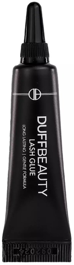 A black tube of eyelash glue with a nozzle, labeled 
