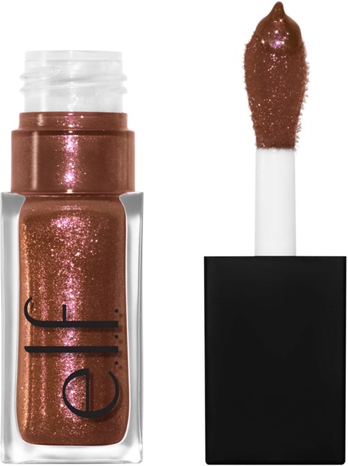 A lipstick with shiny bronze glitter, open, with the applicator showing. The black cap is next to it.