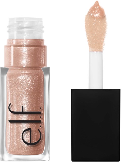 A tube of shimmering beige lip gloss with wand applicator outside the tube. The tube has black text on it.