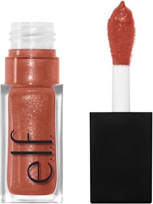 A coral-colored lip gloss with a shiny finish, open with the applicator wand showing. The wand is covered with gloss.