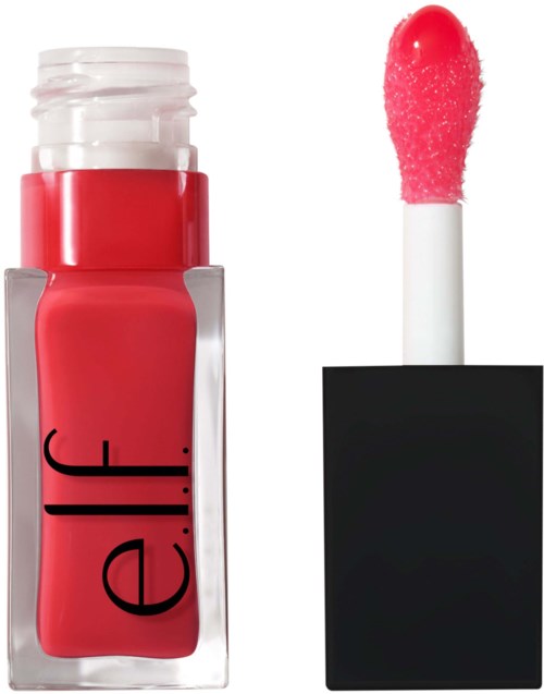 A bottle of bright pink lipstick with a matching applicator beside it.