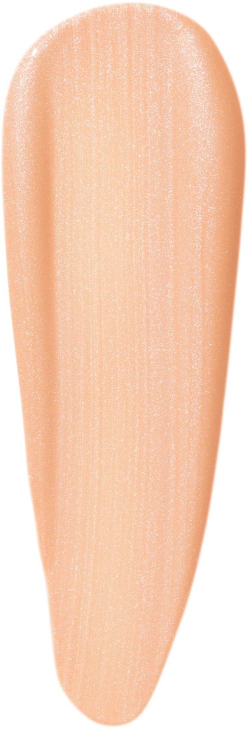 A swatch of light peach-colored nail polish on a nail shape.