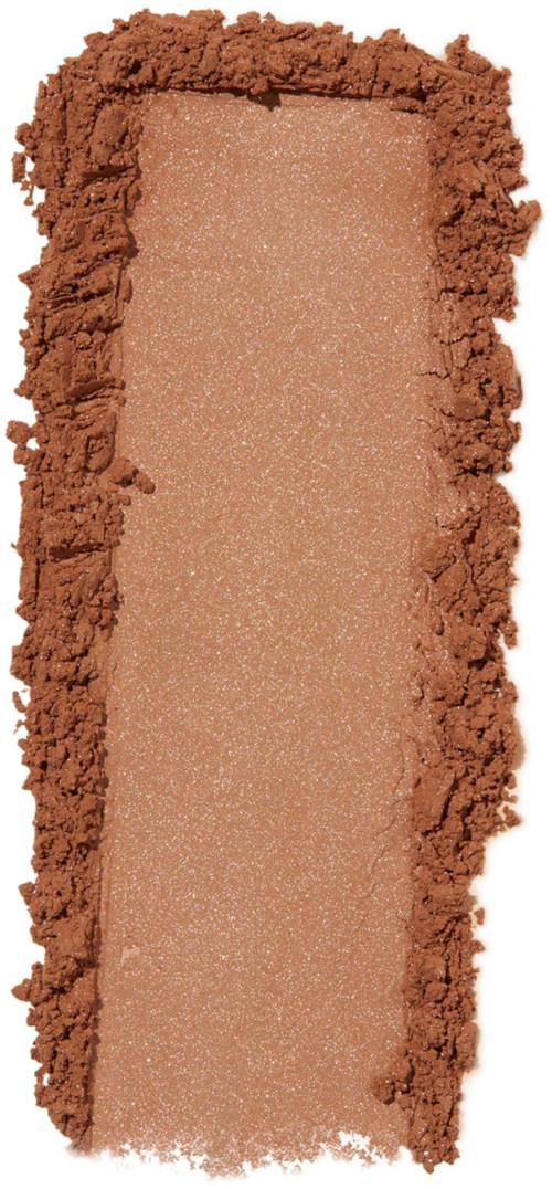 Suorakulmainen kasvojen korostusväri, keskellä hohtava persikka-beige ja ympärillä murskattu ruskea jauhe.