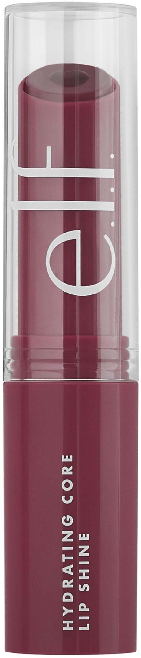 En läppstift i ett klart fodral, mörk rosa nyans, märkt 'Hydrating Core Lip Shine.'