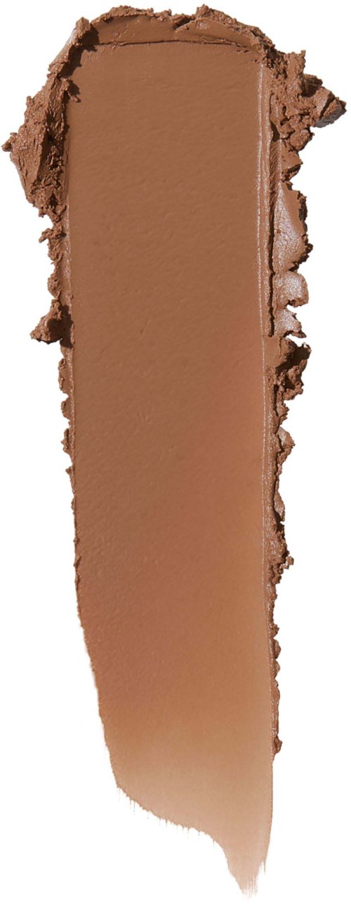 A vertical smear of brown makeup or foundation with rough, torn edges and creamy texture.