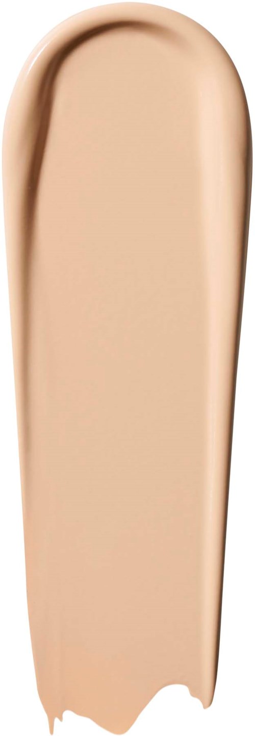 Beige nestemäisen meikkivoiteen levitys pystysuoralle pinnalle, pyöreällä yläosalla.