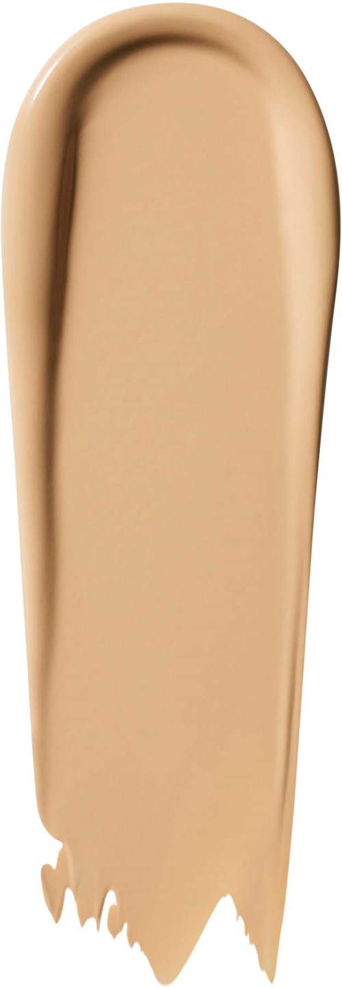 Beige-meikkivoide läikkä valkoisella taustalla, pyöreä ja pitkänomainen muoto.