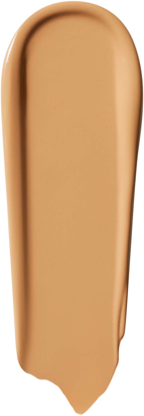 Beige-värinen nestemäinen meikkivoide pitkässä putkessa, jossa on kapea suu.