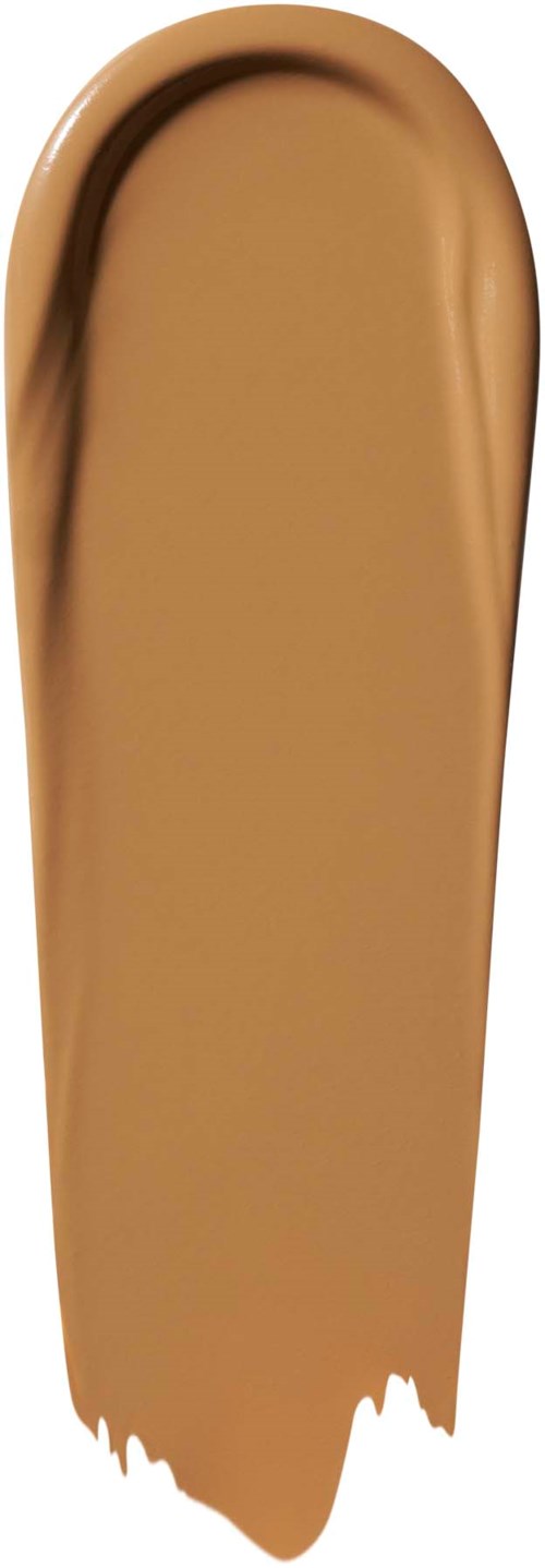 Beige-meikkimuutos kaarevassa muodossa, sileä ja kermaisen tekstuurinen.