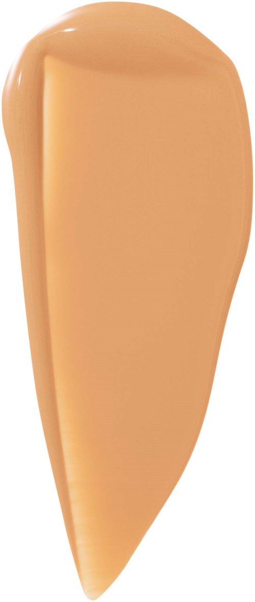 A large, peach-toned spoon with a rounded handle and smooth surface.