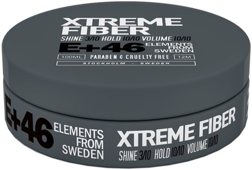Ein runder Behälter mit schwarzen und weißen Etiketten für Xtreme Fiber Haarprodukt, hervorhebt Eigenschaften und Herkunft.