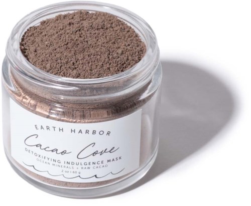 A jar of brown Cacao Clay detoxifying face mask with a white label, showing the brand Earth Harbor.