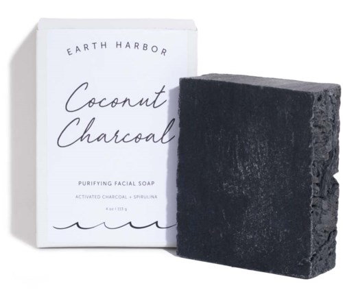 A black soap bar with a white box labeled 'Coconut & Charcoal' on a white background.